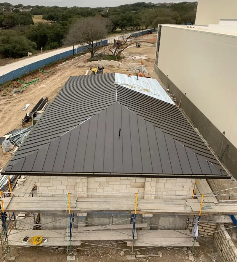 Metal roof new construction with scaffolding in Somers